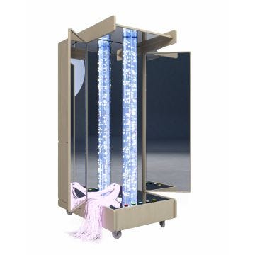 the front of the mobile sensory room cabinet is the bubble calming space which has door openings, encased mirrors, a housed bubble tube, and interactive button knobs 
