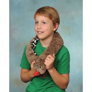 Front view of little boy wearing a Weighted Washable Snuggle Snake around his neck