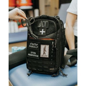 the deadbug dv2 bag multipurpose tactical sling bag in black with written messages on the bag of stretch yourself; stay hydrated and slow is smooth; smooth is fast