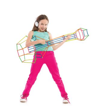 A child using imaginative play with tube in connectors designed to be a guitar.