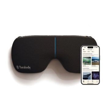 Black Therabody SmartGoggles shaped like a sleep mask and a phone next to it showing the Therabody app.