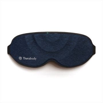 Navy colored Therabody SleepMask that is shaped like a normal sleep mask to fit over the eyes and around the nose.
