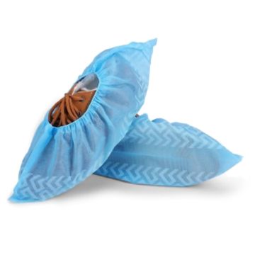 Pair of blue; disposable shoe covers over brown shoes