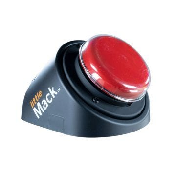 The Ablenet LITTLEmack black base angled up with a red button.