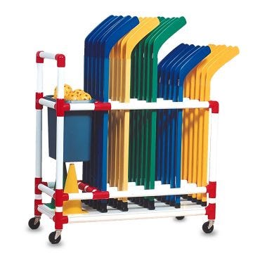 Rolling storage cart made of red and white plastic tubing, neatly holding multiple sets of colored plastic hockey sticks in blue, yellow, green, and orange, with a bin of practice balls and safety cones on the side.