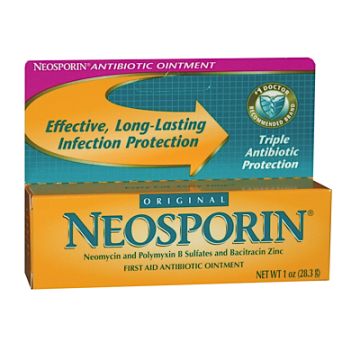 A yellow and green box with words Neosporin Ointment single pack, 1 oz.