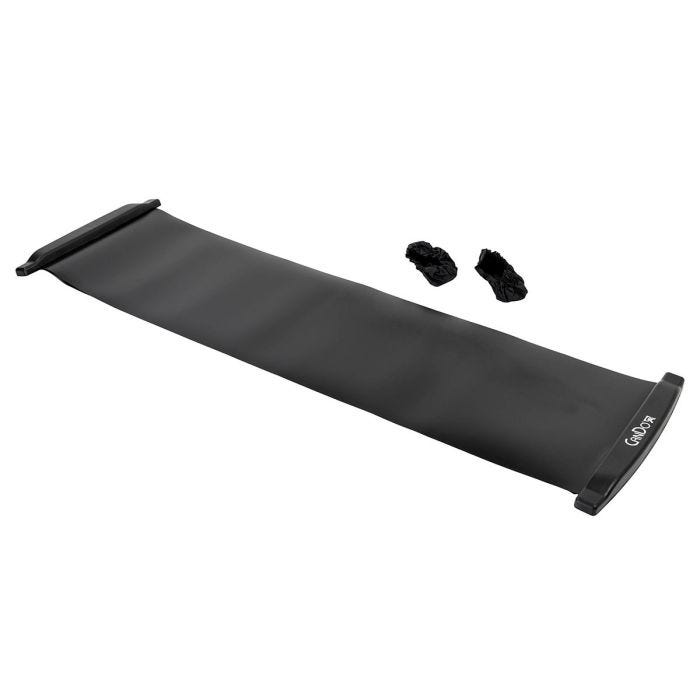 The black Cando Slide Board placed next to two black booties The black Cando Slide Board placed next to two black booties