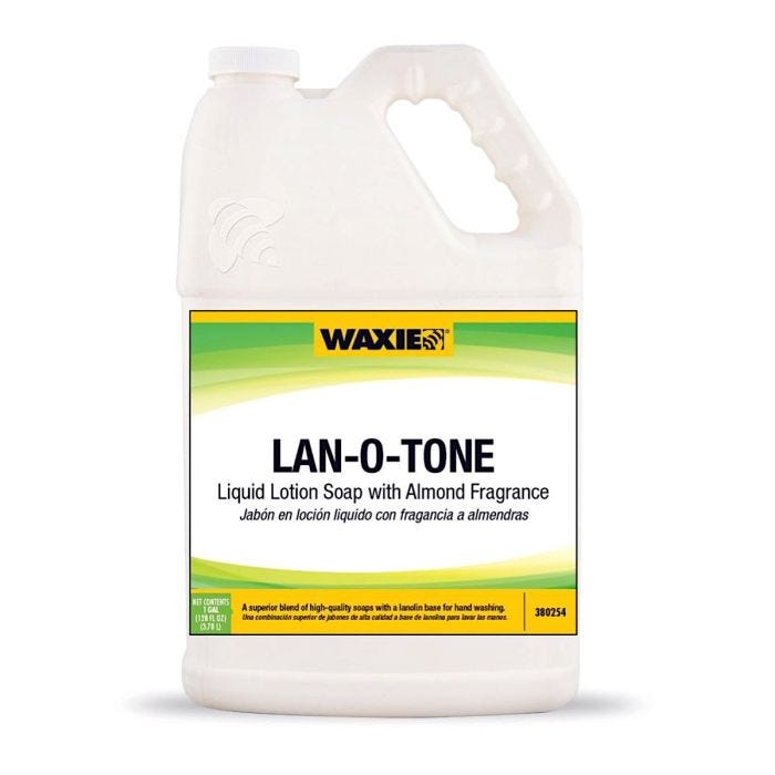 A white gallon bottle of liquid lotion soap with the WAXIE brand logo and Lan-O-Tone on the front. A white gallon bottle of liquid lotion soap with the WAXIE brand logo and Lan-O-Tone on the front.