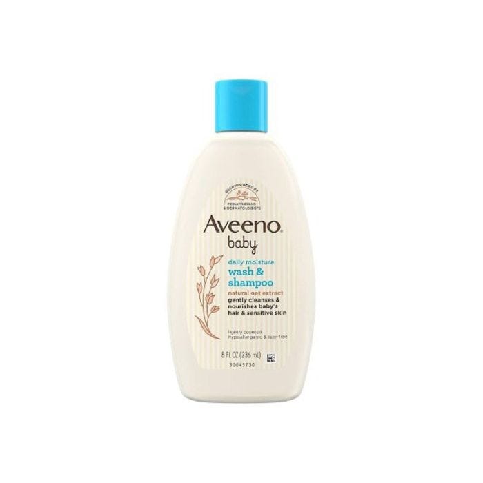 cream colored shampoo bottle with blue cap cream colored shampoo bottle with blue cap