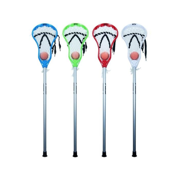 Set of four STX mini lacrosse sticks in blue; green; red; and white; each with a white net and orange ball; shown standing upright side by side. Set of four STX mini lacrosse sticks in blue; green; red; and white; each with a white net and orange ball; shown standing upright side by side.