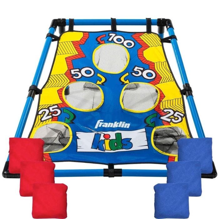 A colorful target board with a blue, yellow, and red design, decorated with point values of 100, 50, and 25. The board is supported by a blue frame with black corner connectors. There are six bean bags in two colors: three red and three blue. A colorful target board with a blue, yellow, and red design, decorated with point values of 100, 50, and 25. The board is supported by a blue frame with black corner connectors. There are six bean bags in two colors: three red and three blue.