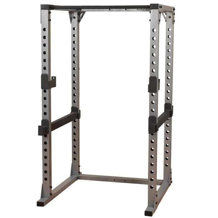 A large steel weightlifting rack with 3-in x 3-in vertical support columns Two black safety bars run parallel, one on each side. A large steel weightlifting rack with 3-in x 3-in vertical support columns Two black safety bars run parallel, one on each side.