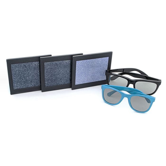 Display of Demonstration card (1) test card (1) blank card (1) with standard Black 3-D viewers (1) and Blue pediatric 3-D viewers (1) on White background Display of Demonstration card (1) test card (1) blank card (1) with standard Black 3-D viewers (1) and Blue pediatric 3-D viewers (1) on White background